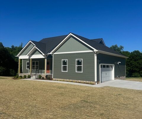 Front and side exterior of new construction home on Liberty Road in Charlotte, TN